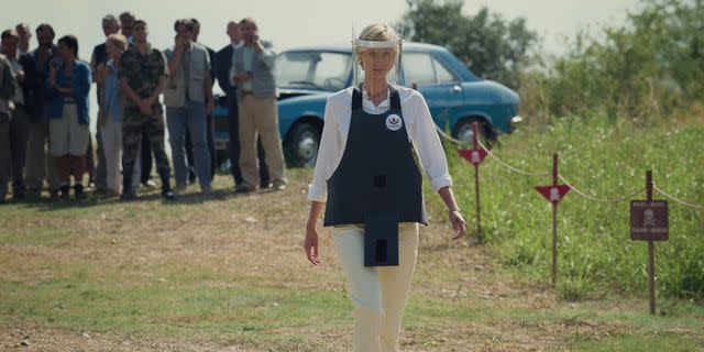 <p>Courtesy Netflix</p> Elizabeth Debicki reenacts Princess Diana's walk through an active landmine in Angola in 1997 in season 6 of "The Crown."