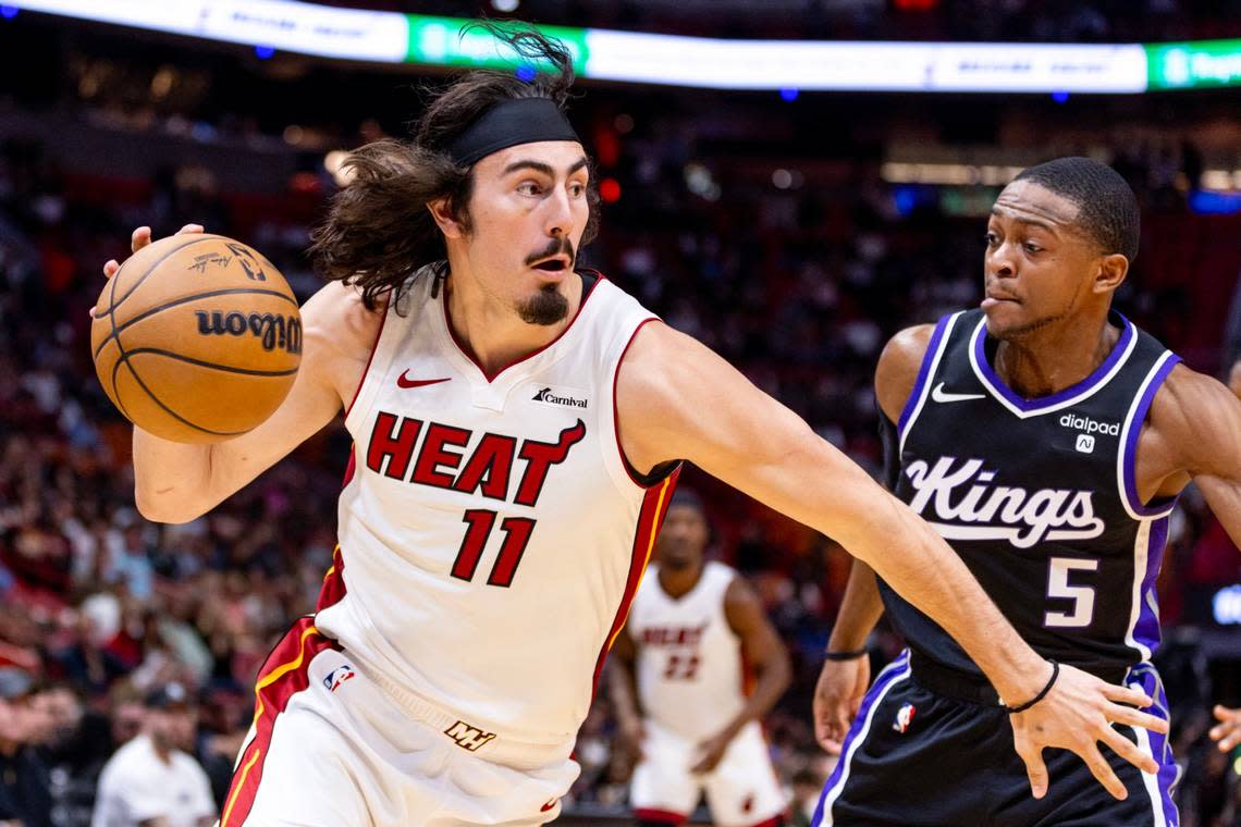 Miami Heat guard Jaime Jaquez Jr. (11) drives on Sacramento Kings guard De’Aaron Fox (5) during the first half of an NBA game at Kaseya Center in Miami on January 31, 2024.