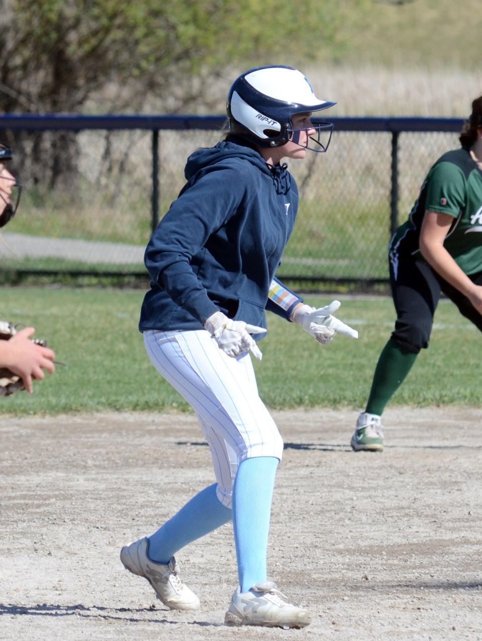 Petoskey senior Katelyn Wodek keeps an eye on a pitch while taking a lead from second base.