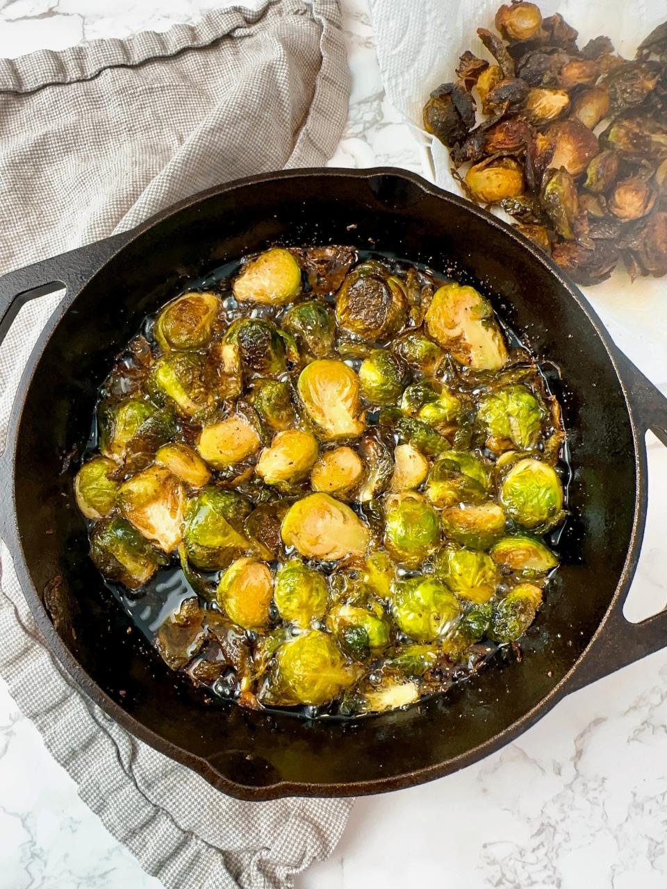 After oven roasting, crisp up your brussels sprouts on the stovetop.