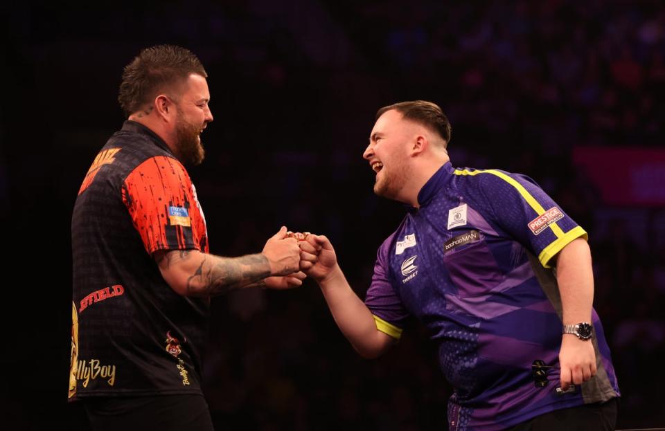 Like Littler and Michael Smith share a joke on night 16 in Sheffield (Getty Images)