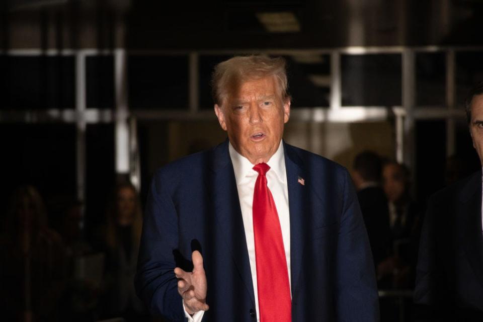 NEW YORK, NEW YORK - APRIL 23: Former U.S. President Donald Trump speaks in the hallway outside of the courtroom at the end of the day's hearing court for his trial for allegedly covering up hush money payments at Manhattan Criminal Court on April 23, 2024 in New York City. Former U.S. President Donald Trump faces 34 felony counts of falsifying business records in the first of his criminal cases to go to trial. (Photo by John Taggart-Pool/Getty Images)