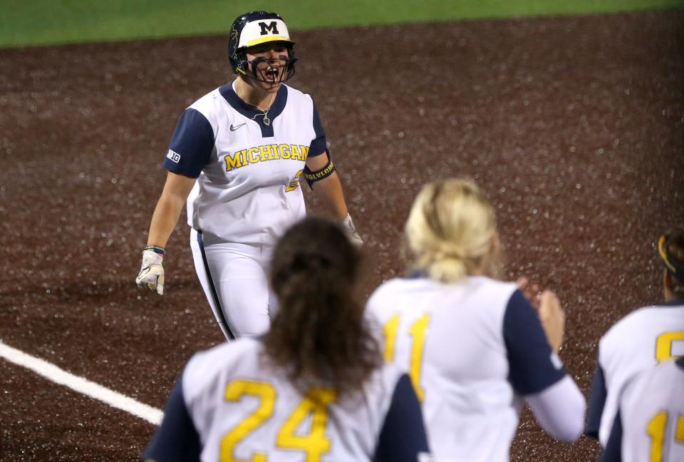 Michigan’s Keke Tholl (2) reacts while running to home plate after hitting a home run during the Big Ten softball tournament Friday, May 10, 2024 in Iowa City, Iowa.