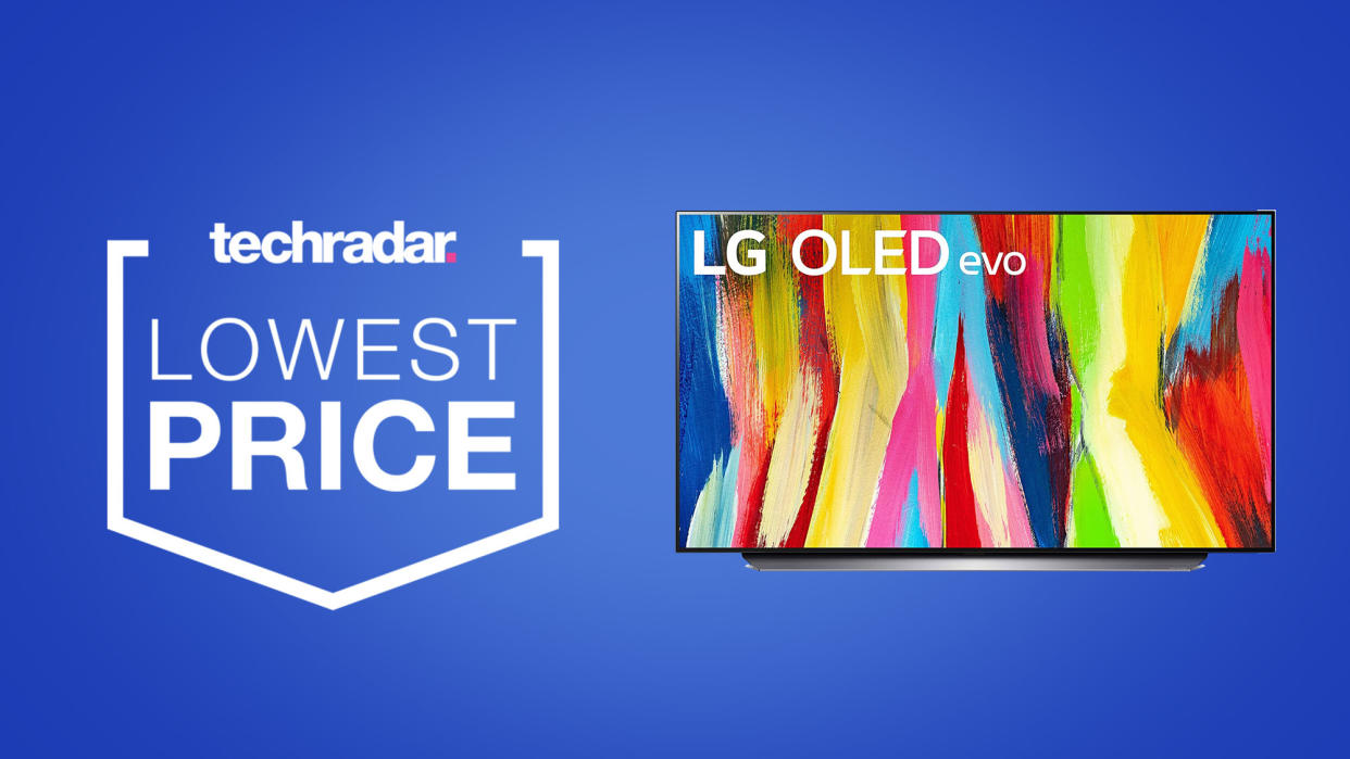  LG C2 OLED TV on a blue background next to TechRadar deals lowest price badge 