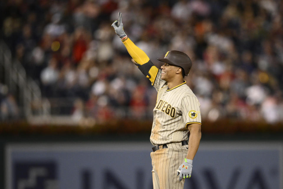 San Diego Padres' Juan Soto gestures at second after he doubled during the fifth inning of the team's baseball game against the Washington Nationals, Friday, Aug. 12, 2022, in Washington. (AP Photo/Nick Wass)