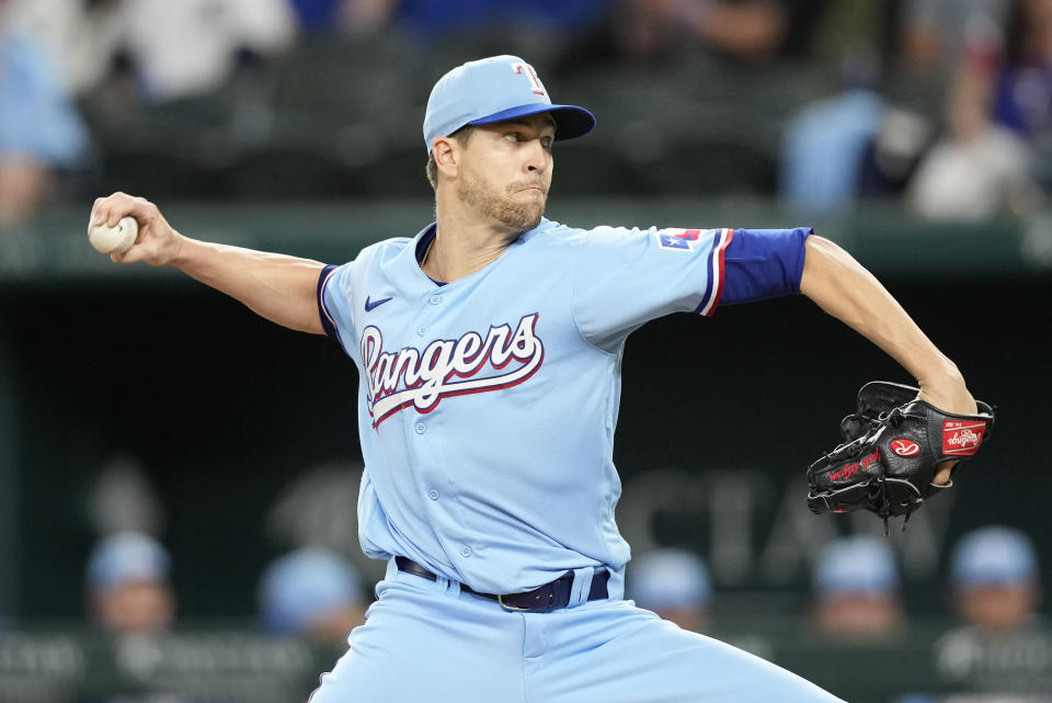 Texas Rangers starting pitcher Jacob deGrom delivers a pitch to the Oakland Athletics during the first inning of a baseball game, Sunday, April 23, 2023, in Arlington, Texas. (AP Photo/Jim Cowsert)