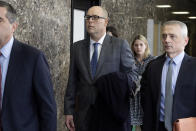 Inman Majors, center, father of Barnard College student Tessa Majors who was fatally stabbed during a robbery in December, leaves court, Wednesday, Feb. 19, 2020, in New York. He attended the court appearance of Rashaun Weaver, who is charged with second-degree murder and robbery in the attack on 18-year-old Tessa Majors. (AP Photo/Richard Drew)