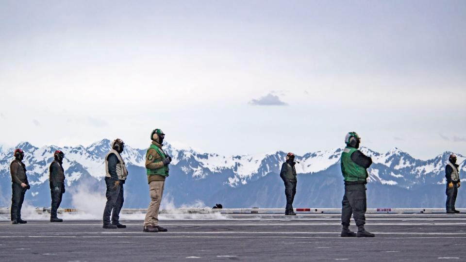 Crew on flight deck of USS Theodore Roosevelt flight deck