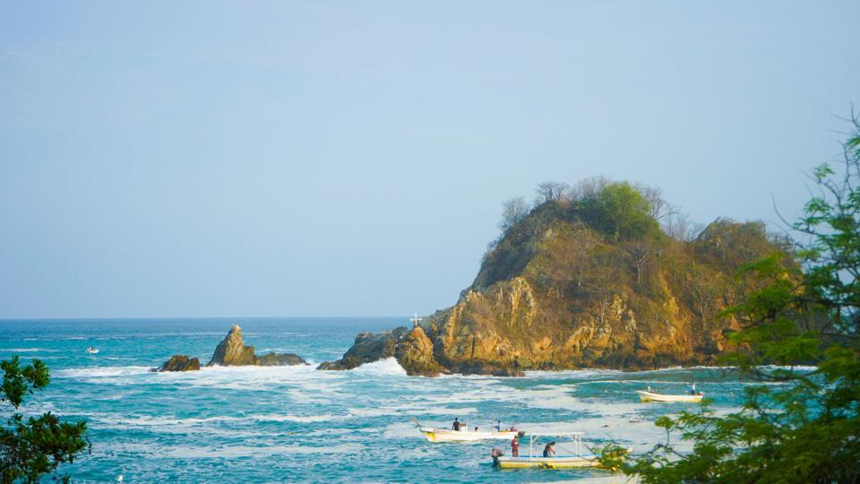 Boats in the water at Puerto Angel