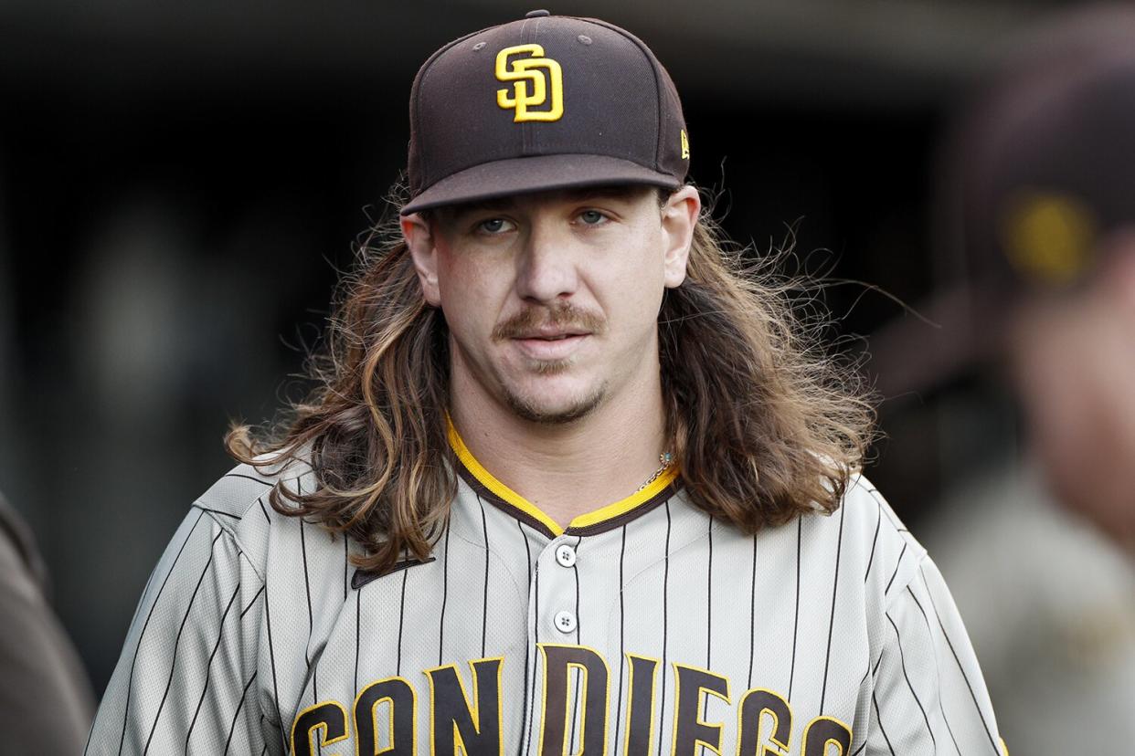 San Diego Padres starting pitcher Mike Clevinger (52) walks in the dugout during a game between the San Diego Padres and San Francisco Giants
