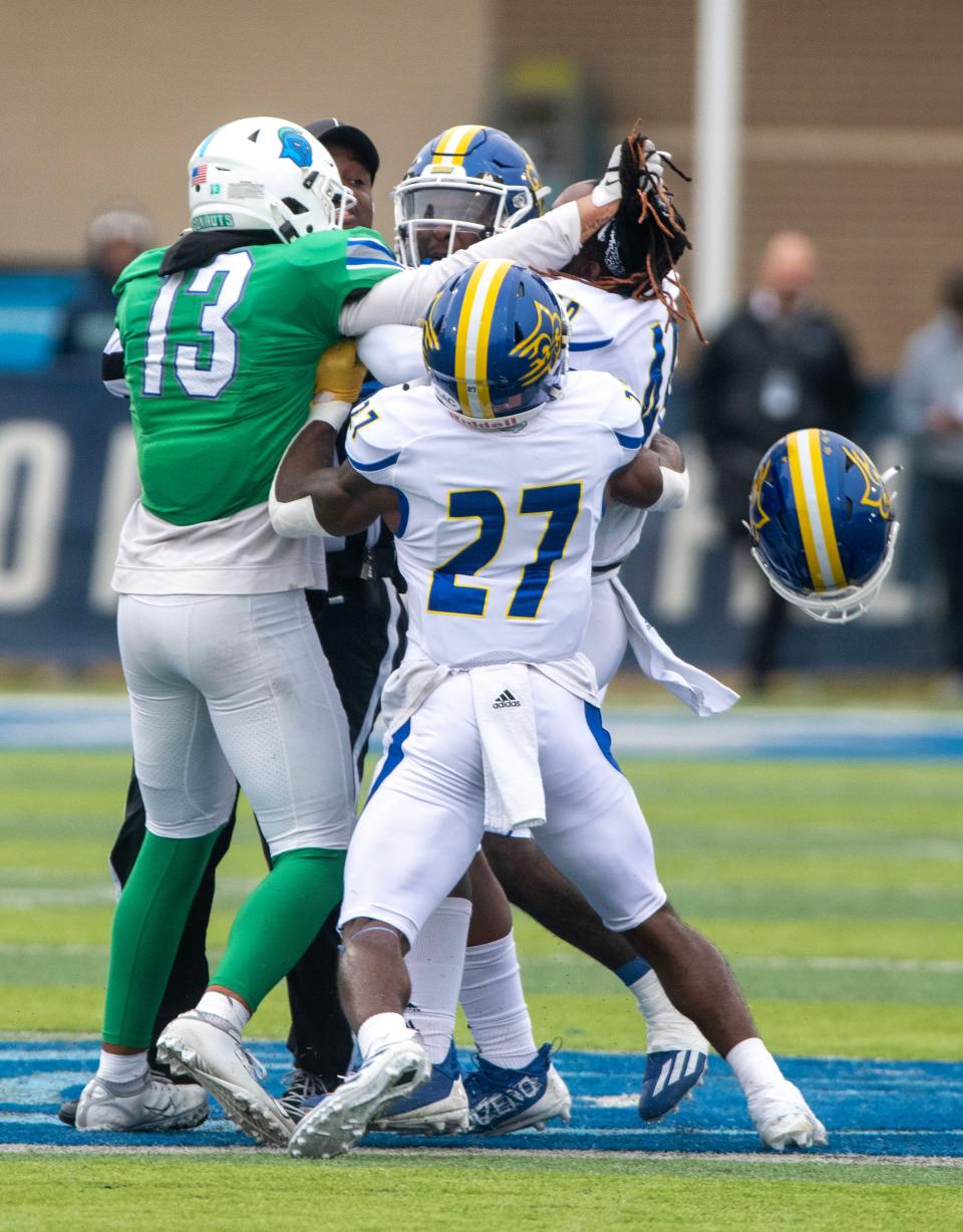 West Florida and Limestone players tussle during first round of the 2022 NCAA Division II Football Championship against the Limestone Saints at Pen Air Field Saturday, November 19, 2022.. West Florida went on to beat Limestone 45-19.
