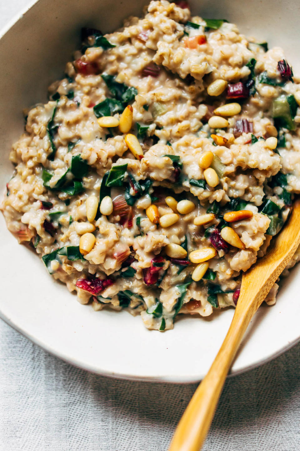 <strong>Get the <a href="http://www.wholeheartedeats.com/2018/02/creamy-steel-cut-oats-with-rainbow-chard-pine-nuts/" target="_blank">Creamy Steel Cut Oats with Rainbow Chard and Pine Nuts recipe </a>from Wholehearted Eats</strong>, reprinted with permission from <i><a href="https://www.amazon.com/Simply-Vibrant-Vegetarian-Colorful-Plant-Based/dp/1611803845/ref=sr_1_1?ie=UTF8&amp;qid=1520273127&amp;sr=8-1&amp;keywords=Simply+Vibrant" target="_blank">Simply Vibrant</a></i><i>&nbsp;</i>by Anya Kassoff