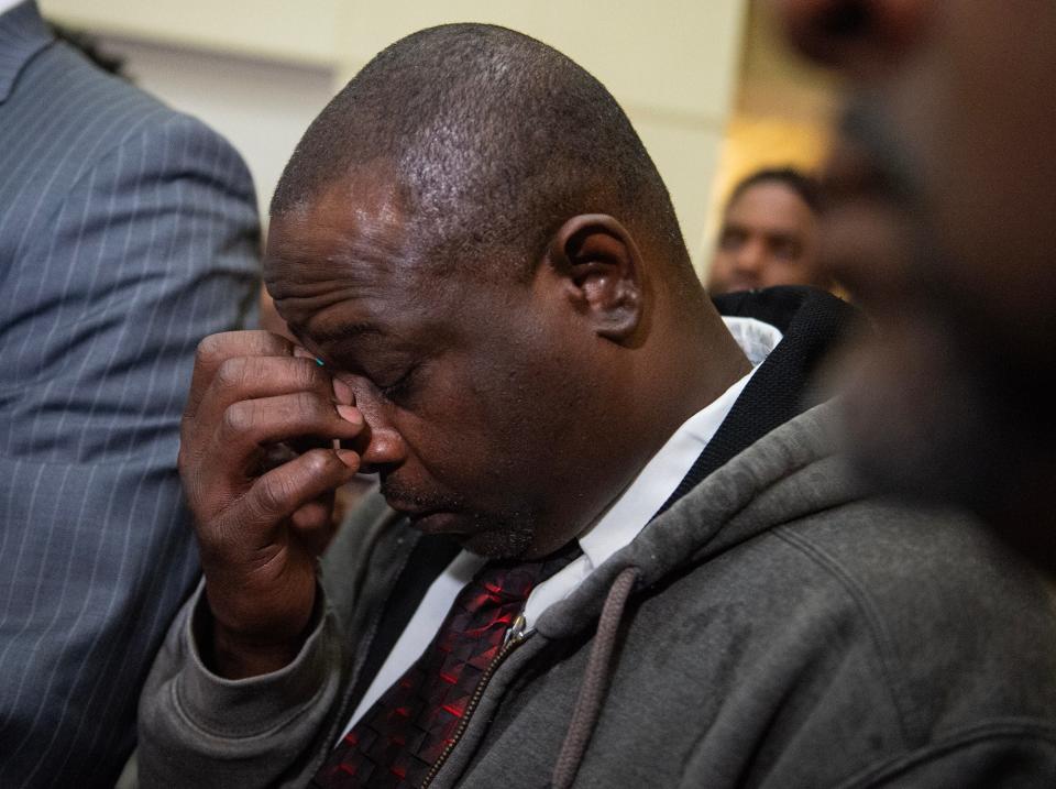 'Goon Squad' victim Eddie Parker listens to lawyer Malik Shabazz speak during a press conference after the sentencing at the Rankin County Circuit Court in Brandon on Wednesday.