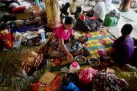 Flood-affected residents rest at an evacuation camp in Kalay, upper Myanmar's Sagaing region, on August 2, 2015