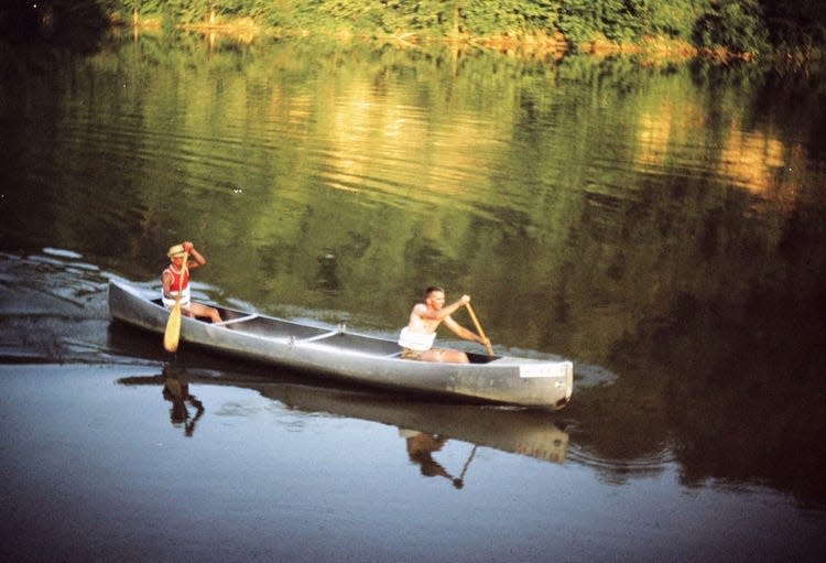 Jim Ecenbarger and Bill Malcuit prepare to canoe down another dam on their trip from Dover, Ohio to New Orleans, Louisiana.