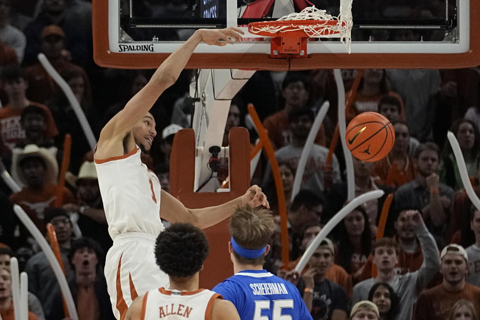 Texas forward Dylan Disu (1) scores against Creighton during the first half of an NCAA college basketball game in Austin, Texas, Thursday, Dec. 1, 2022. (AP Photo/Eric Gay)