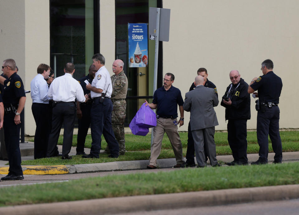 <p>Bags are carried away from the scene of a shooting along Wesleyan at Law Street in Houston that left multiple people injured and the alleged shooter dead, Monday morning, Sept. 26, 2016. (Mark Mulligan/Houston Chronicle via AP) </p>