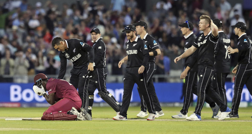 New Zealand's Ross Taylor consoles West Indies' Carlos Brathwaite at the end of the Cricket World Cup match between New Zealand and West Indies at Old Trafford in Manchester, England, Saturday, June 22, 2019. Brathwaite blazed 101 from 82 balls as the last three West Indies wickets combined for 122 runs and got within one shot of a spectacular comeback victory. He went for broke, trying to hit the last ball of the 49th over from Jimmy Neesham for six and was caught on the long-on boundary by Trent Boult. (AP Photo/Jon Super)