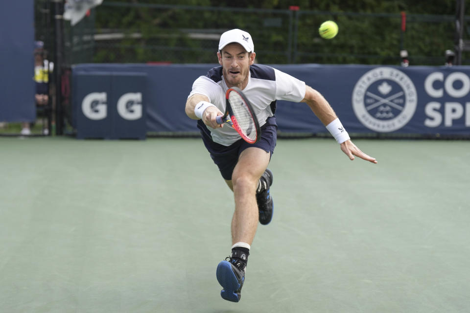 Britain's Andy Murray strains to reach a shot from Australia's Max Purcell during the National Bank Open men’s tennis tournament Wednesday, Aug. 9, 2023, in Toronto. (Chris Young/The Canadian Press via AP)