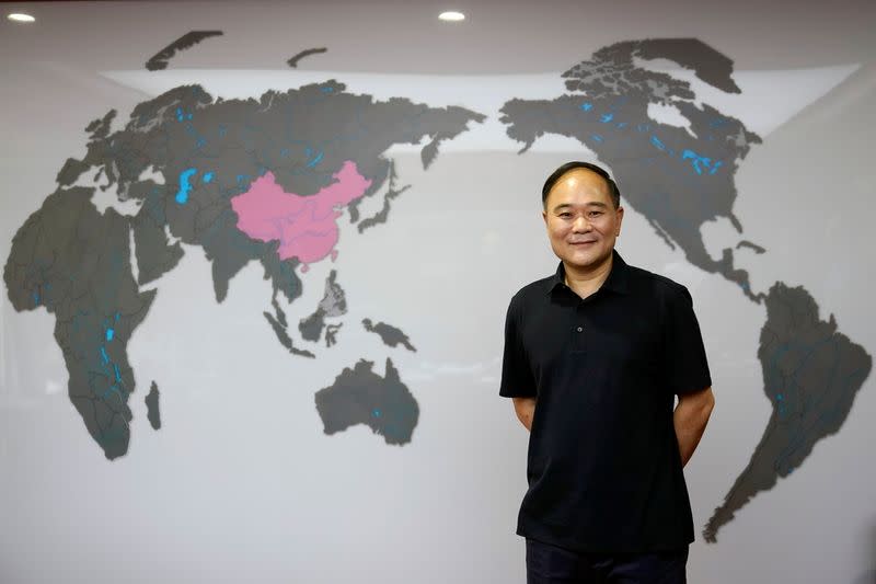 Zhejiang Geely Holding Group's Chairman Li Shufu poses for pictures at his office in Hangzhou