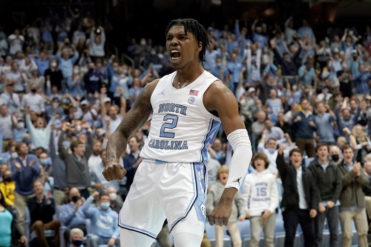 North Carolina guard Caleb Love enjoys a dunk against Michigan as the home crowd approves Wednesday night at the Smith Center.