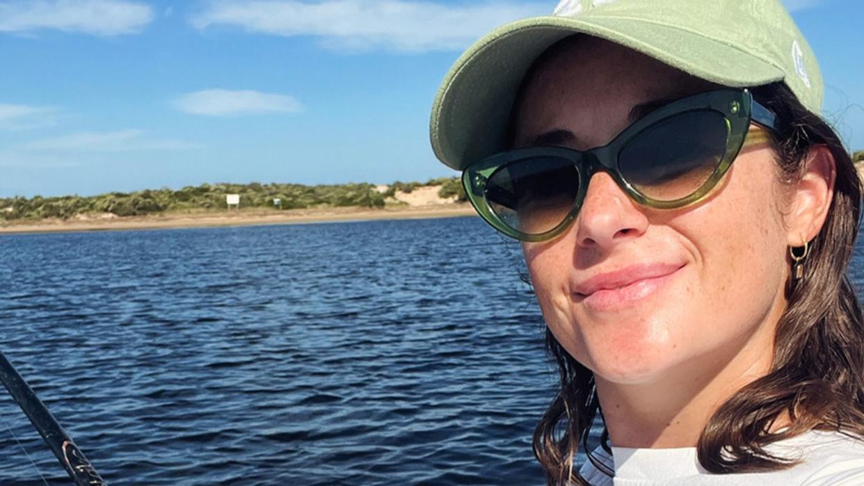 woman on a boat in a cap