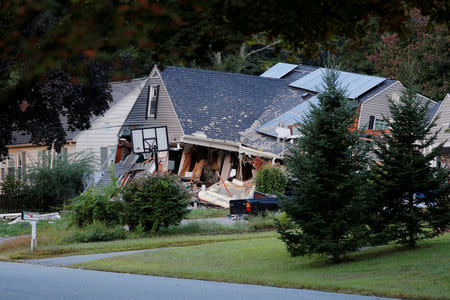 FILE PHOTO: A home sits collapsed where a man died in a series of gas explosions in Lawrence, Massachusetts, U.S., September 14, 2018. REUTERS/Brian Snyder/File Photo