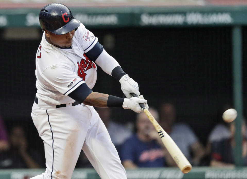 Cleveland Indians' Jose Ramirez hits a three run home run in the third inning in a baseball game against the Boston Red Sox, Monday, Aug. 12, 2019, in Cleveland. Carlos Santana and Franmil Reyes scored on the play. (AP Photo/Tony Dejak)