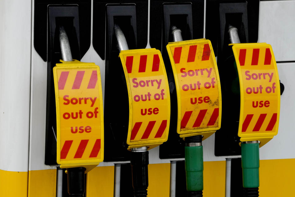 Closed fuel pumps at a petrol station in London, Tuesday, Sept. 28, 2021. Long lines of vehicles have formed at many gas stations around Britain since Friday, causing spillover traffic jams on busy roads. (AP Photo/Frank Augstein)