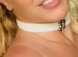 Close-up of necklace around  Britney's neck