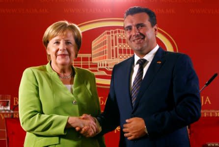 Macedonian Prime Minister Zoran Zaev and German Chancellor Angela Merkel shake hands after a news conference in Skopje, Macedonia September 8, 2018. REUTERS/Ognen Teofilovski