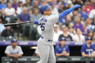 Los Angeles Dodgers' Trayce Thompson flies out against Colorado Rockies starting pitcher Chad Kuhl during the third inning of a baseball game Monday, June 27, 2022, in Denver. (AP Photo/David Zalubowski)