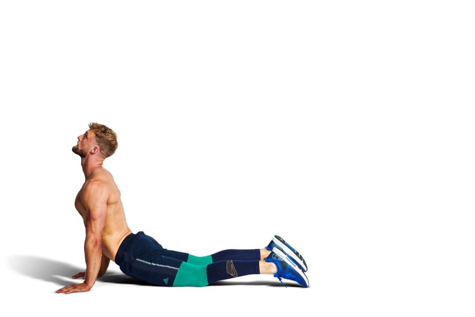 <p><strong><strong>Muscles stretched: Lower b</strong>ack</strong></p><p><strong>How to:</strong> Roll over onto your front and get yourself into a low cobra, by bending at your lower back and lifting <a href="https://www.menshealth.com/uk/building-muscle/a759235/best-chest-exercises-for-building-muscle/" rel="nofollow noopener" target="_blank" data-ylk="slk:your chest;elm:context_link;itc:0;sec:content-canvas" class="link ">your chest</a>. Support the weight of the body on your hands, but with your elbows bent. If that feels comfortable straighten your arms, either a little more, so you're in high cobra, or fully, so you're in an upward-facing dog position, as in the image shown.</p>