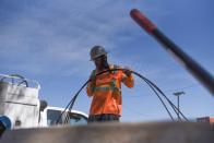 FILE PHOTO: A power crew works to restore 5G in Houston