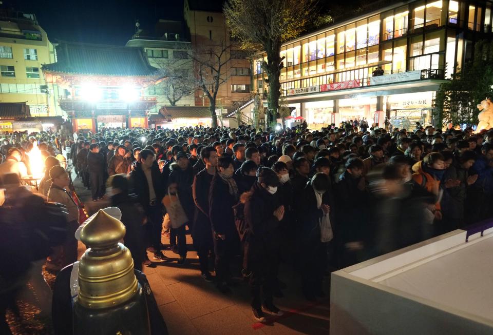 People visit Kanda Myojin Shrine to offer New Year prayers in Tokyo on January 1, 2019. Millions of Japanese people will visit shrines and temples across the country during the first three days of the new year to pray for the well-being of their families.