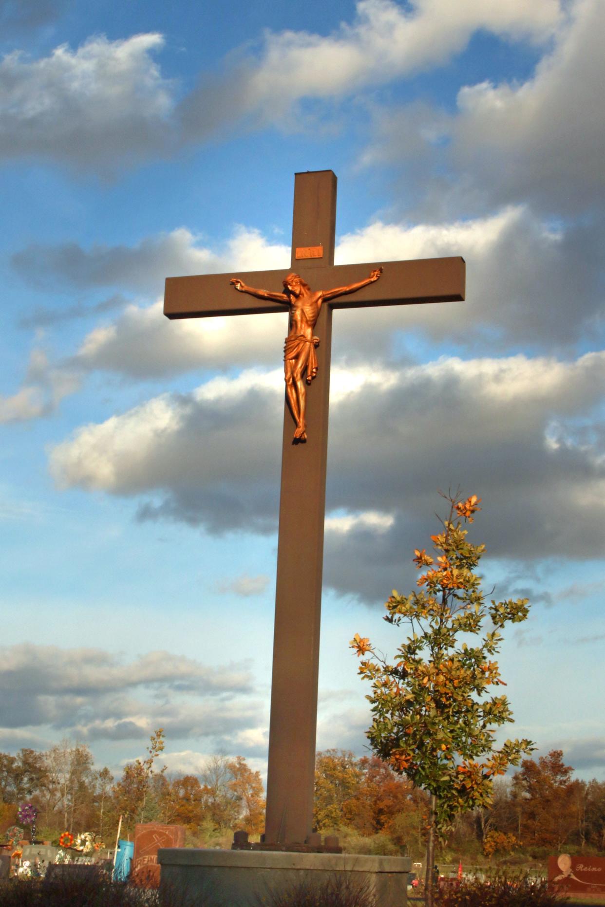 This is Easter Week for area Christian churches. Numerous services are planned as are Easter Egg Hunts for youth. The cross is pictures near sunset at Gibsonburg's Saint Lawrence Cemetary in Gibsonburg.
