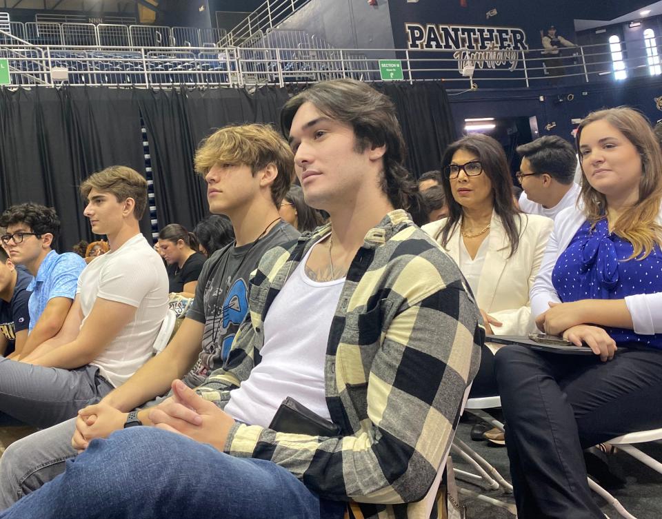 AJ Seker, 18, listens to Vice President Kamala Harris speak to students at Florida International University.