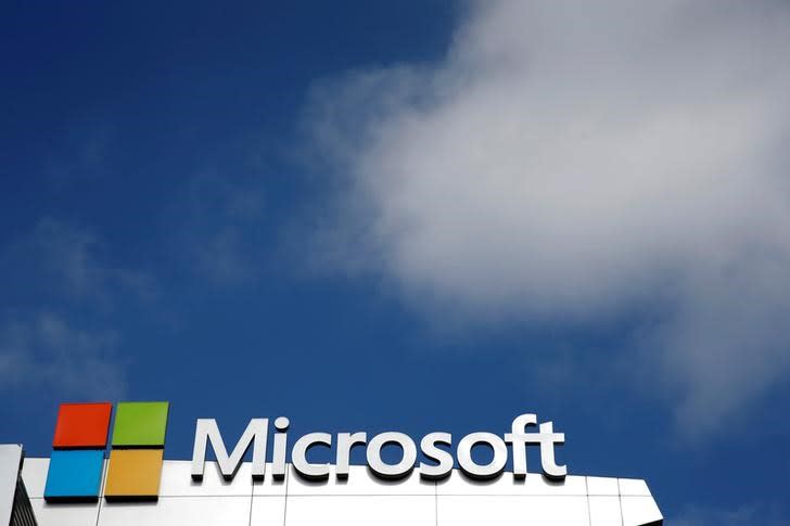 FILE PHOTO: A Microsoft logo is seen next to a cloud in Los Angeles, California, U.S. on June 14, 2016. REUTERS/Lucy Nicholson/File Photo
