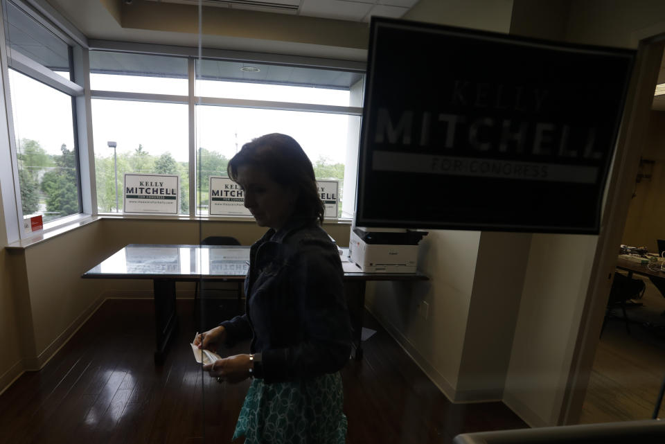 Indiana State Treasurer Kelly Mitchell leaves her campaign office, Thursday, May 28, 2020, in Westfield, Ind. Mitchell is a candidate for Indiana's 5th Congressional District. More Republican women than ever are seeking House seats this year after the 2018 election further diminished their limited ranks in Congress. But so far it appears that any gains this November could be modest. (AP Photo/Darron Cummings)