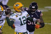 Green Bay Packers' Aaron Rodgers throws a pass during the second half of an NFL football game against the Chicago Bears Sunday, Jan. 3, 2021, in Chicago. (AP Photo/Nam Y. Huh)