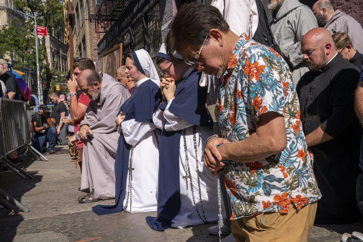 Roman Catholic nuns pray with anti-abortion activists across the street from a Planned Parenthood clinic in New York in September 2023. <a href="https://www.gettyimages.com/detail/news-photo/roman-catholic-nuns-pray-with-a-group-of-anti-abortion-news-photo/1655599179?adppopup=true" rel="nofollow noopener" target="_blank" data-ylk="slk:Robert Nickelsberg/Getty Images;elm:context_link;itc:0;sec:content-canvas" class="link ">Robert Nickelsberg/Getty Images</a>