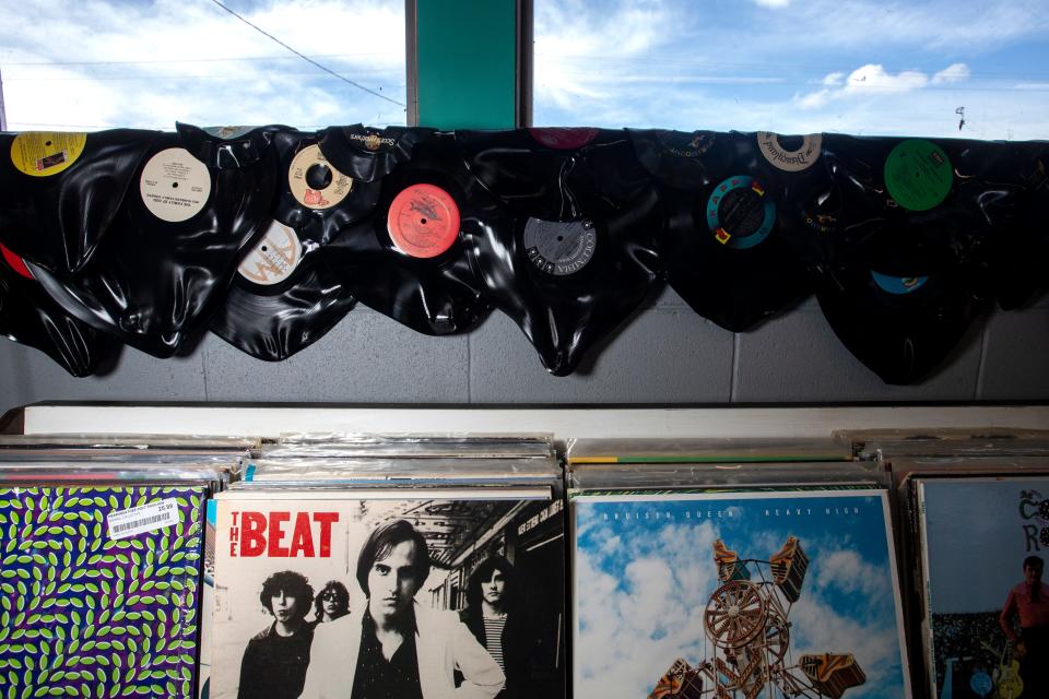 Owner Jacque Pierre had some fun melting records to the wall of Green Bay UFO Museum Gift Shop and Records. Most are easy listening or damaged records, but he said he did take personal delight in aiming the heat gun at an Eric Clapton album.