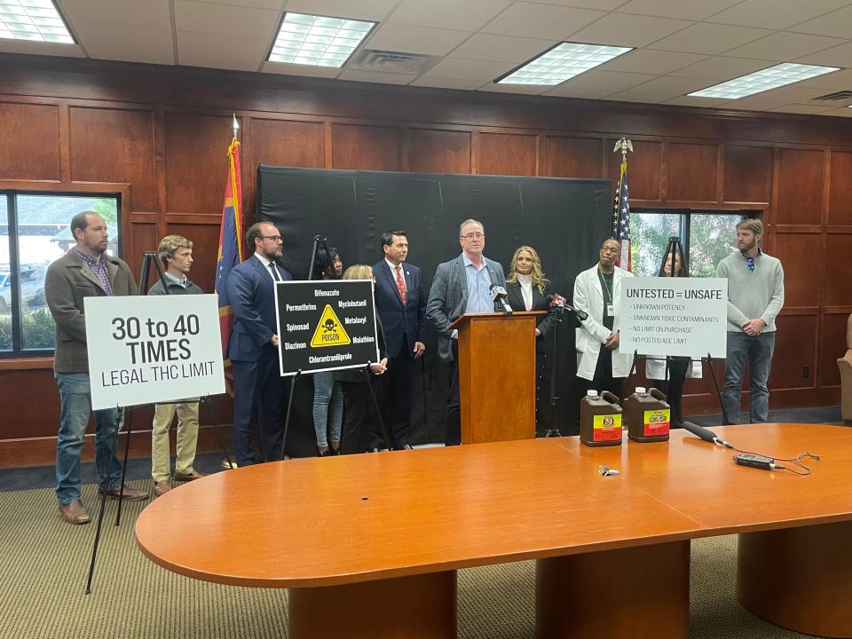Cliff Osbon, president and co-founder of cannabis testing lab Steep Hill Mississippi, Representative Lee Yancey (left) and other members of Steep Hill Mississippi, hold a press conference announcing the discovery of illegal amounts of THC in legal cannabis products found throughout the state.