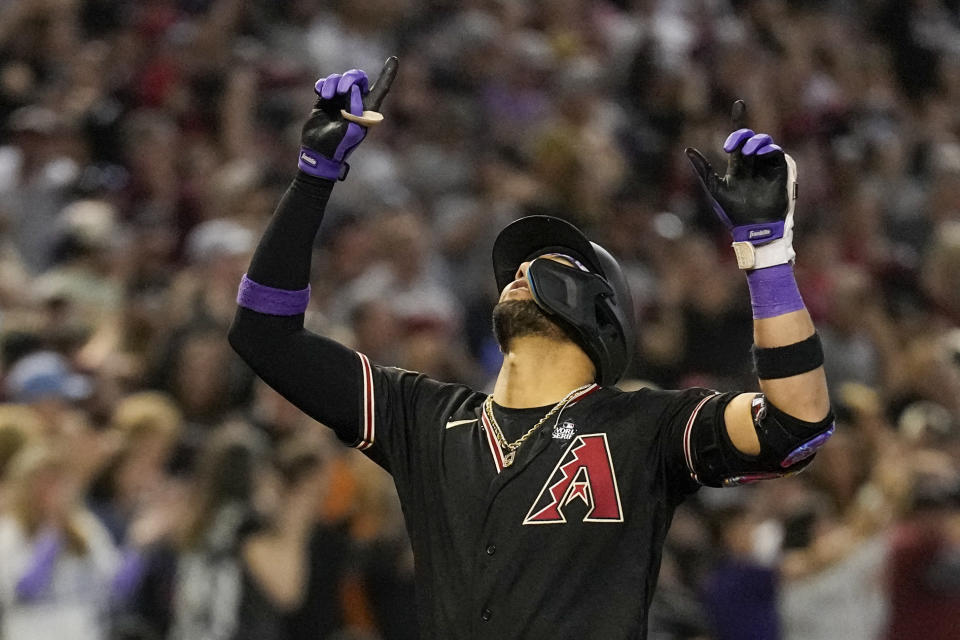 Arizona Diamondbacks' Lourdes Gurriel Jr. celebrates after a three-run home run against the Texas Rangers during the eighth inning in Game 4 of the baseball World Series Tuesday, Oct. 31, 2023, in Phoenix. (AP Photo/Brynn Anderson)