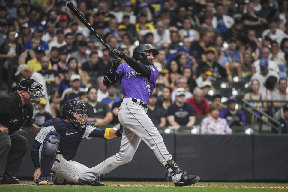 Colorado Rockies' Charlie Blackmon flies out during the third inning of the team's baseball game against the Milwaukee Brewers on Saturday, July 23, 2022, in Milwaukee. (AP Photo/Kenny Yoo)