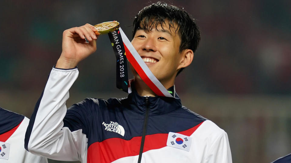 Son Heung-min has his hands on the gold medal. Pic: Getty