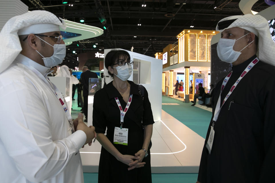 Visitors and exhibitors wear masks at the Arab Health Exhibition in Dubai, United Arab Emirates, Wednesday, Jan. 29, 2020. The United Arab Emirates on Wednesday confirmed the first cases in the Mideast of the new Chinese virus that causes flu-like symptoms, saying doctors now were treating a family that had just come from a city at the epicenter of the outbreak. (AP Photo/Kamran Jebreili)