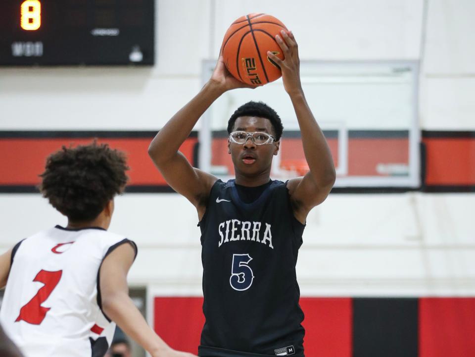 Bryce James #5 of the Sierra Canyon Trailblazers looks to pass the ball against the Cleveland Cavaliers at Cleveland High School on November 19, 2022 in Reseda, California.