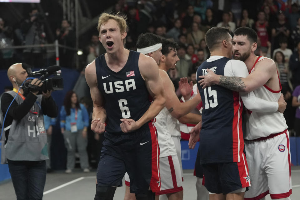 FILE - United States' Canyon Barry celebrates winning the men's 3x3 basketball gold medal match against Chile at the Pan American Games in Santiago, Chile, Monday, Oct. 23, 2023. The son of Hall of Famer Rick Berry played collegiately at the College of Charleston and Florida. He was the 2017 Academic All-American of the Year and has a bachelor’s degree in physics and master’s degree in nuclear engineering. He is known for his unorthodox underhand free-throw shooting, which helped him shoot 88.3% from the line as a senior. (AP Photo/Dolores Ochoa, File)