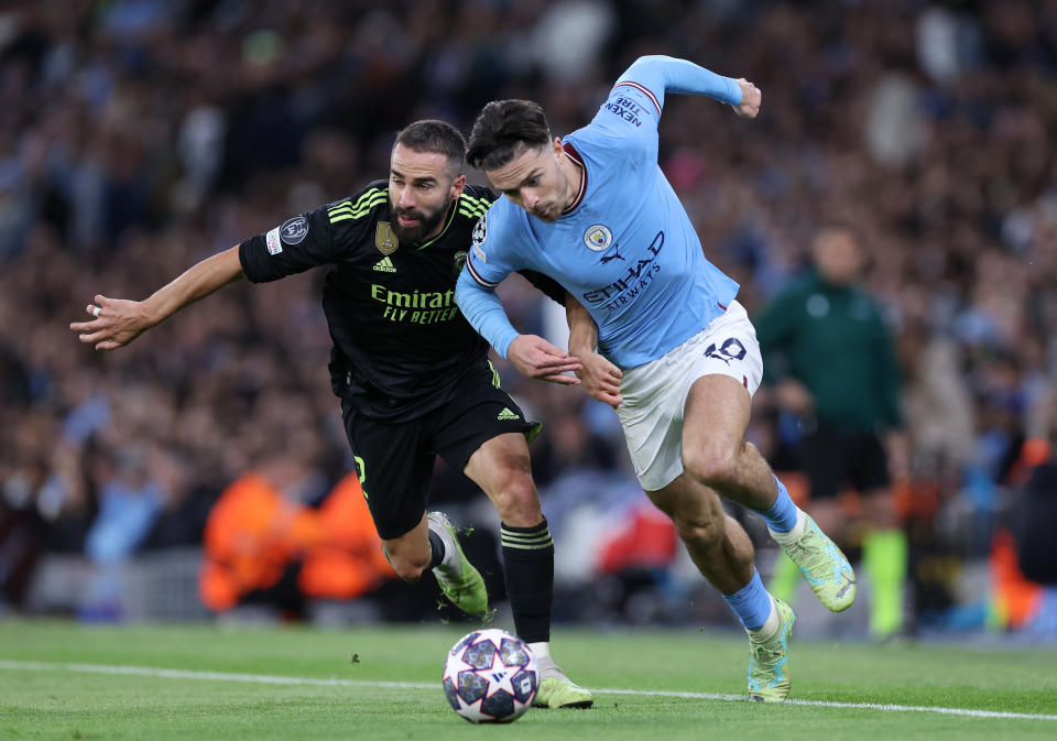 Manchester City's Jack Grealish (right) battles with Real Madrid's Dani Carvajal in the Uefa Champions League semi-final clash. 